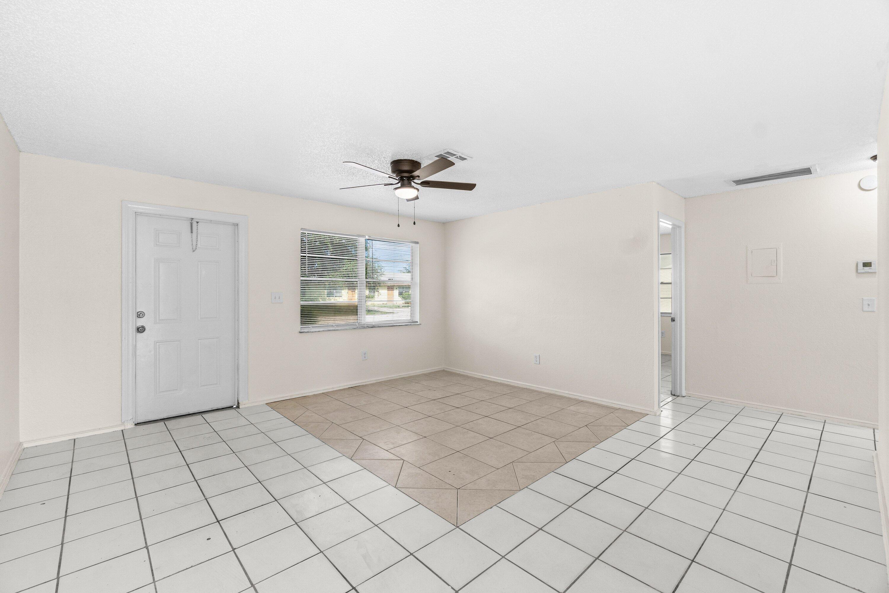 4869 Gulfstream Road Lake Worth, FL 33461 - Photo 7 of 20 a view of an empty room and window