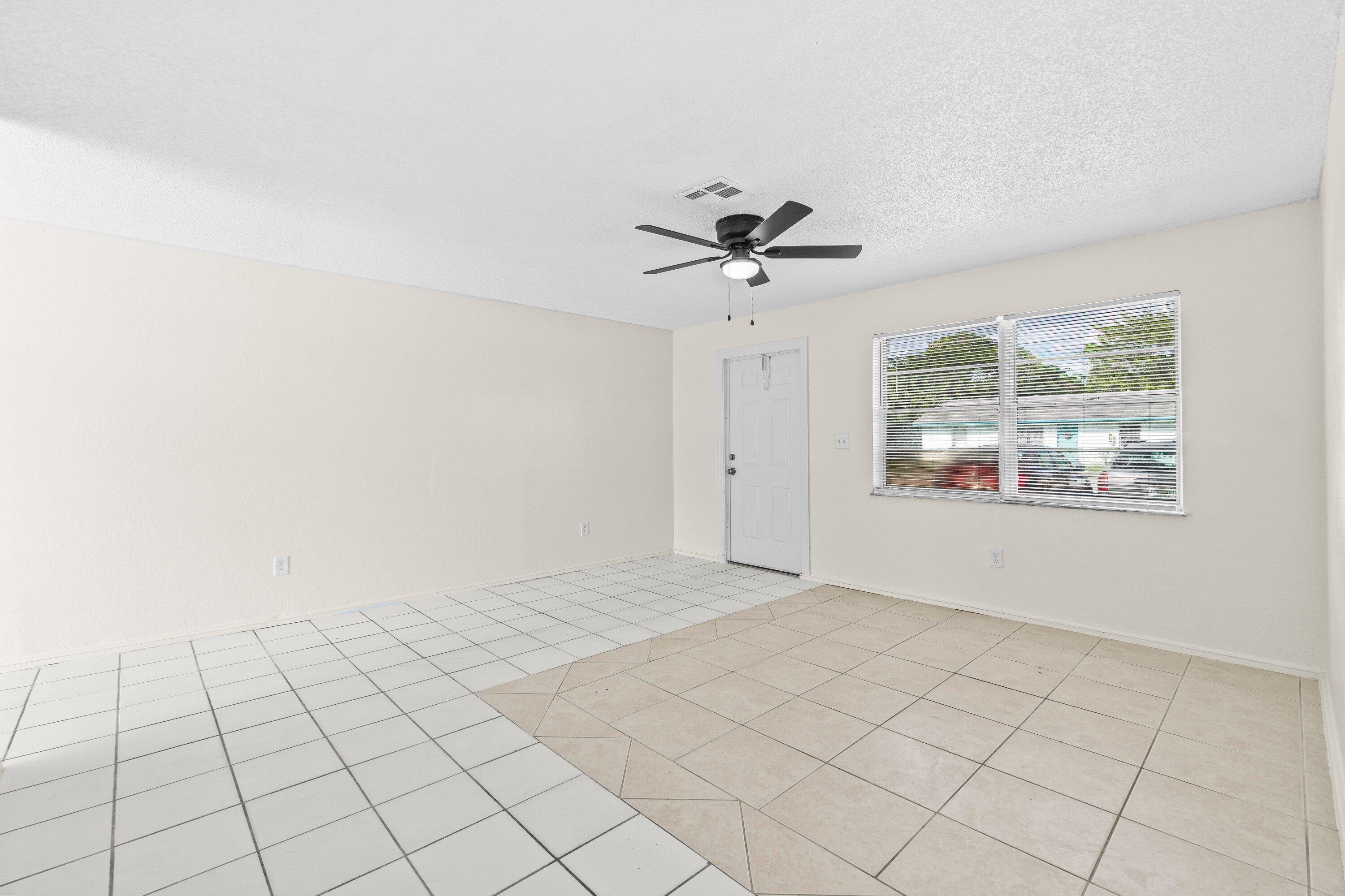 4869 Gulfstream Road Lake Worth, FL 33461 - Photo 10 of 20 a view of an empty room and window