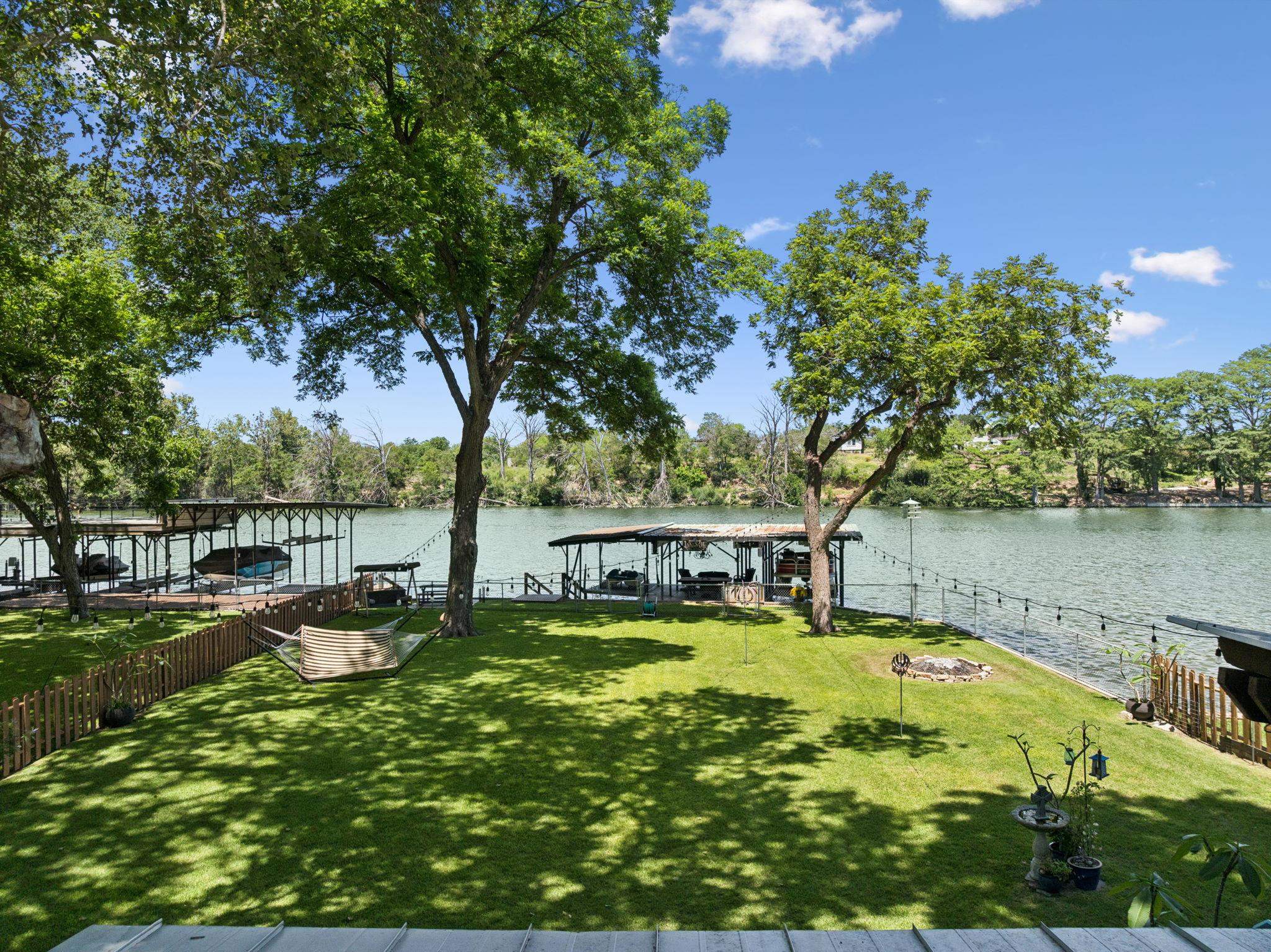 1435 East Zipp Road New Braunfels, TX 78130 - Photo 5 of 43 a view of a swimming pool with a patio and a yard