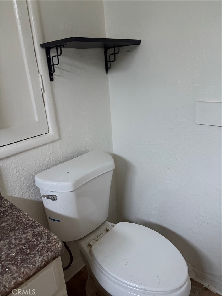 10206 South Vermont Avenue Los Angeles, CA 90044 - Photo 5 of 11 a white toilet sitting next to a small bathroom
