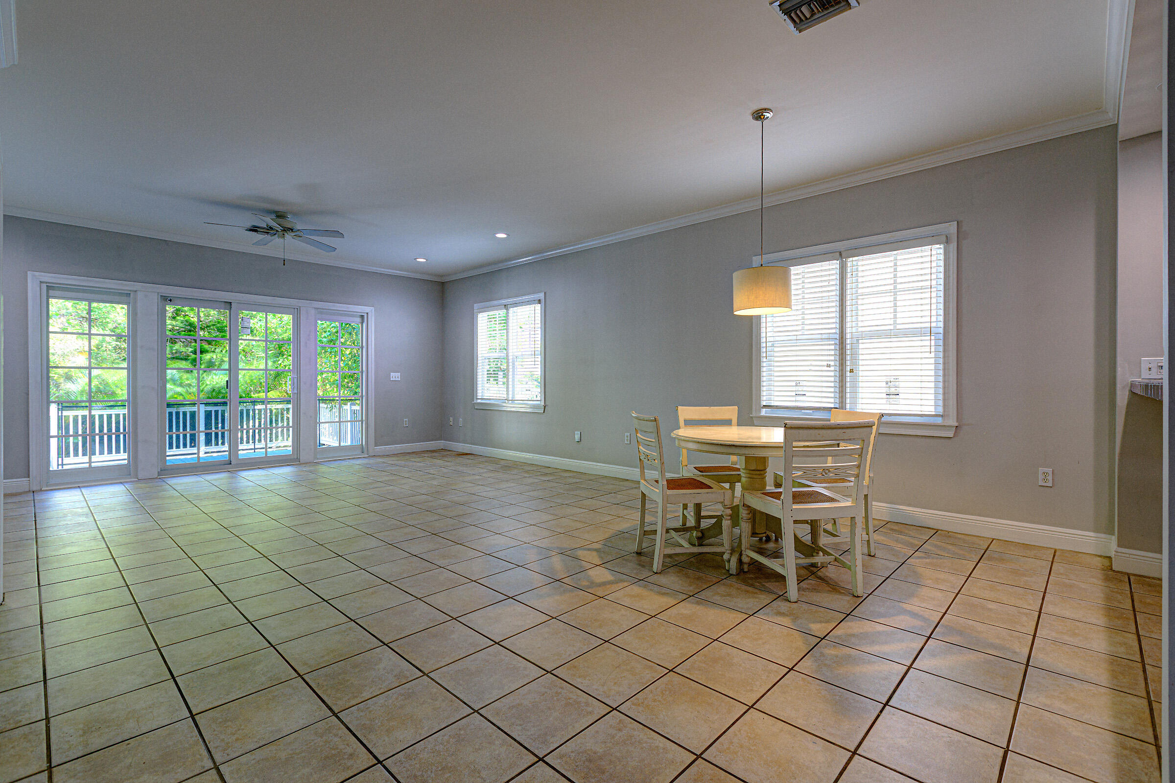 263 Golf Club Drive Key West, FL 33040 - Photo 7 of 30 a view of a dining room with furniture and chandelier