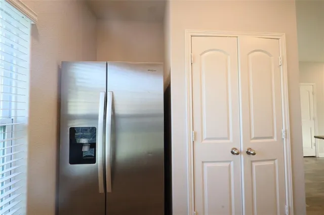 a bathroom with a glass shower door