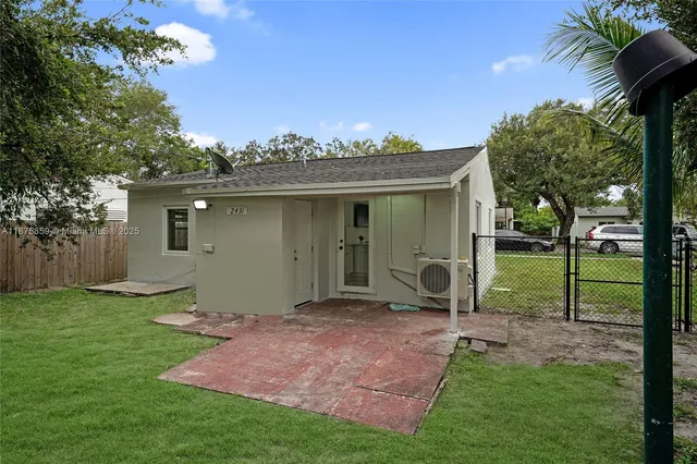 a view of a backyard with a garden and plants