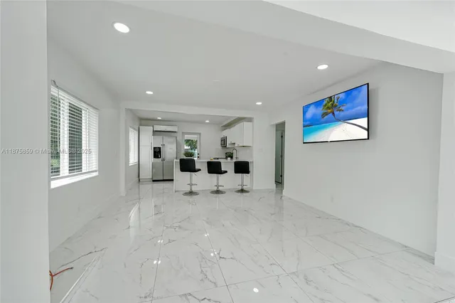 a view of livingroom with furniture and window