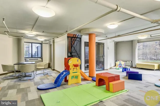 a view of a livingroom with furniture and a potted plant