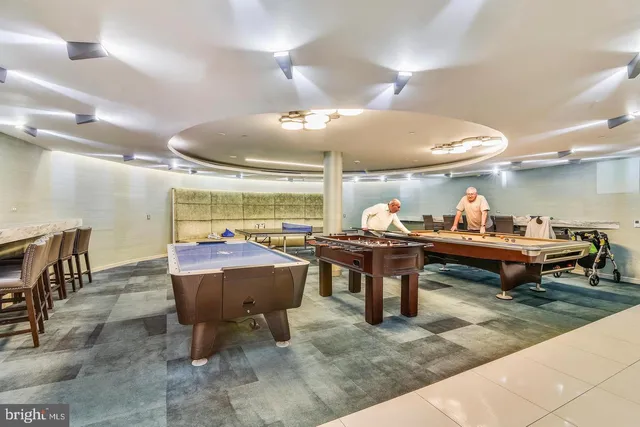 a view of a patio with dining table and chairs
