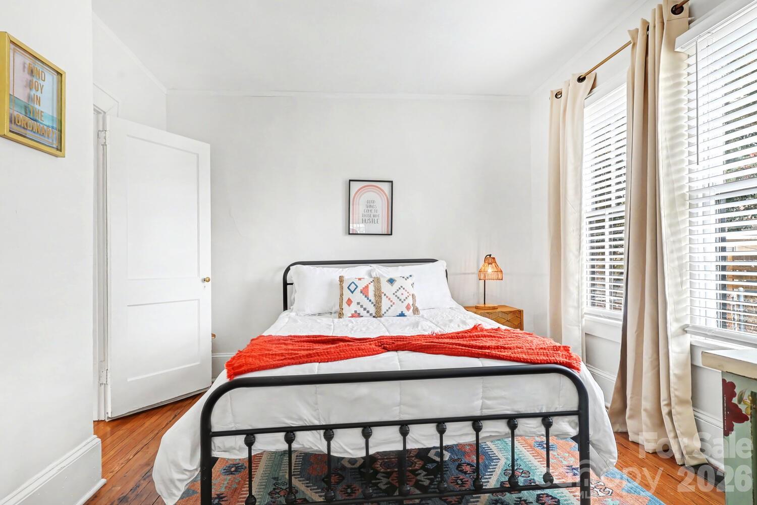 335 South Torrence Street Charlotte, NC 28204 - Photo 13 of 21 a bedroom with a bed and a window