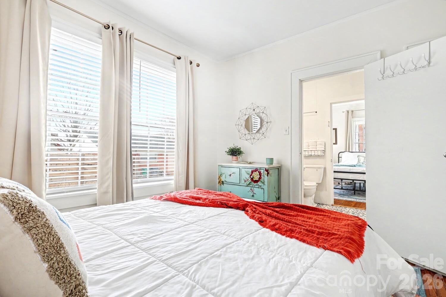 335 South Torrence Street Charlotte, NC 28204 - Photo 14 of 21 a bedroom with a bed and a window