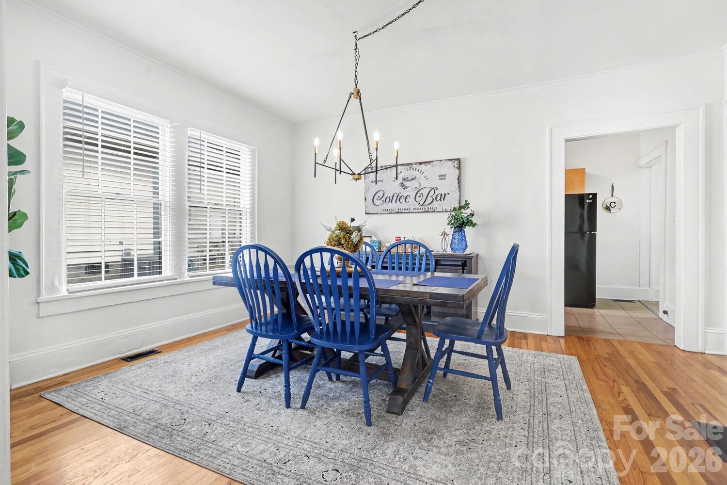 335 South Torrence Street Charlotte, NC 28204 - Photo 16 of 21 a view of a dining room with furniture window and wooden floor