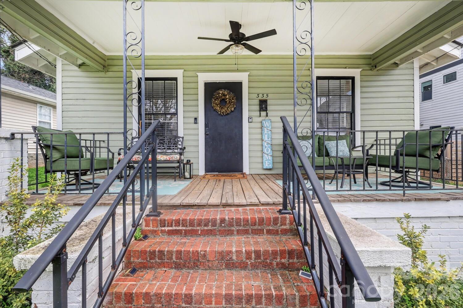 335 South Torrence Street Charlotte, NC 28204 - Photo 2 of 21 a view of a patio with couches table and chairs