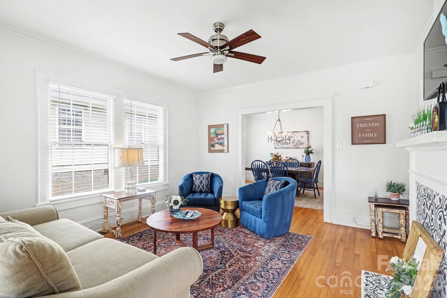 335 South Torrence Street Charlotte, NC 28204 - Photo 4 of 21 a living room with furniture and a window