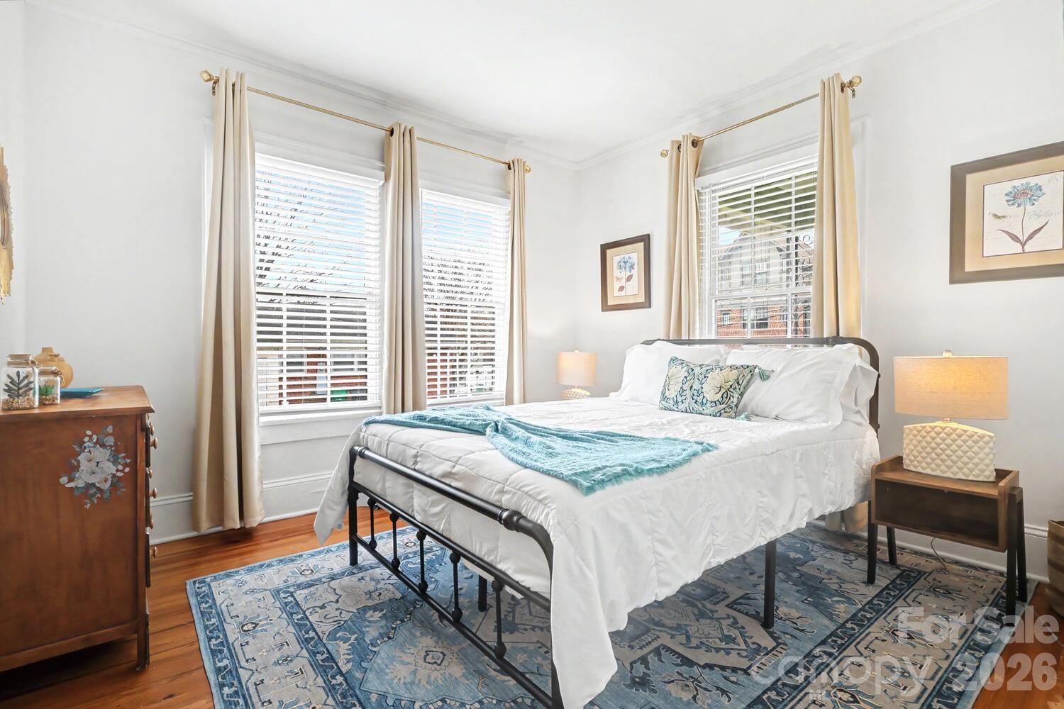 335 South Torrence Street Charlotte, NC 28204 - Photo 9 of 21 a bedroom with a bed table and a window
