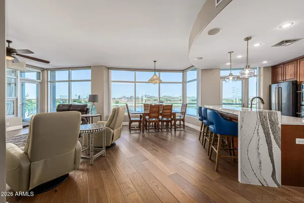 a view of a dining room with furniture window and wooden floor