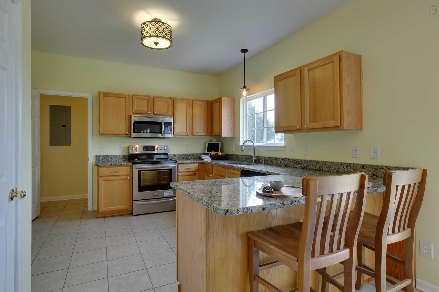 1735 Liberty Pike Franklin, TN 37067 - Photo 14 of 30 a kitchen with a stove cabinets and a refrigerator