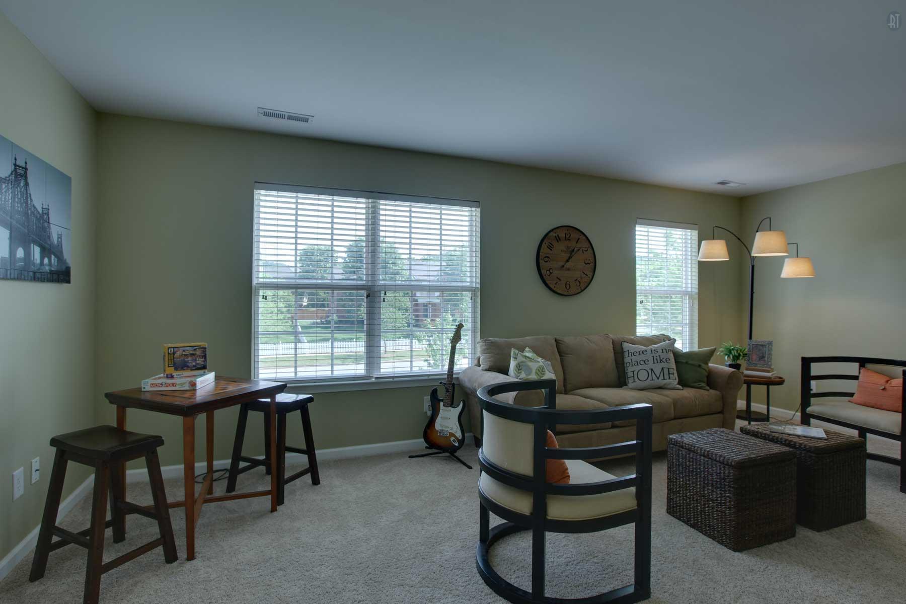1735 Liberty Pike Franklin, TN 37067 - Photo 19 of 30 a living room with furniture a clock and a window