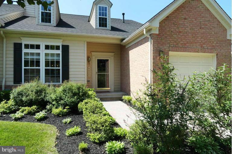 8411 Meadowsweet Road Pikesville, MD 21208 - Photo 1 of 30 a front view of a house with a yard