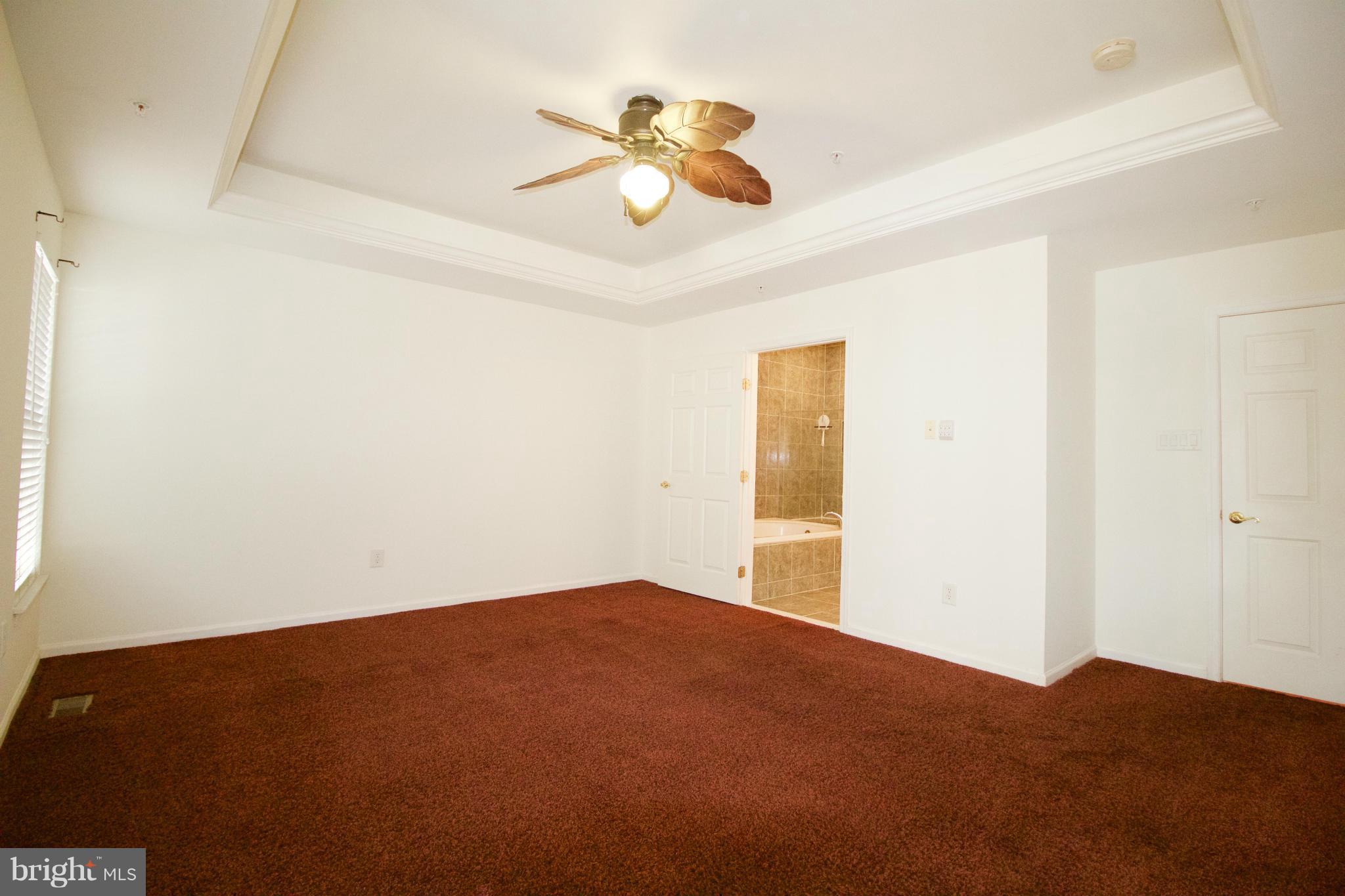 8411 Meadowsweet Road Pikesville, MD 21208 - Photo 14 of 30 a view of empty room with ceiling fan