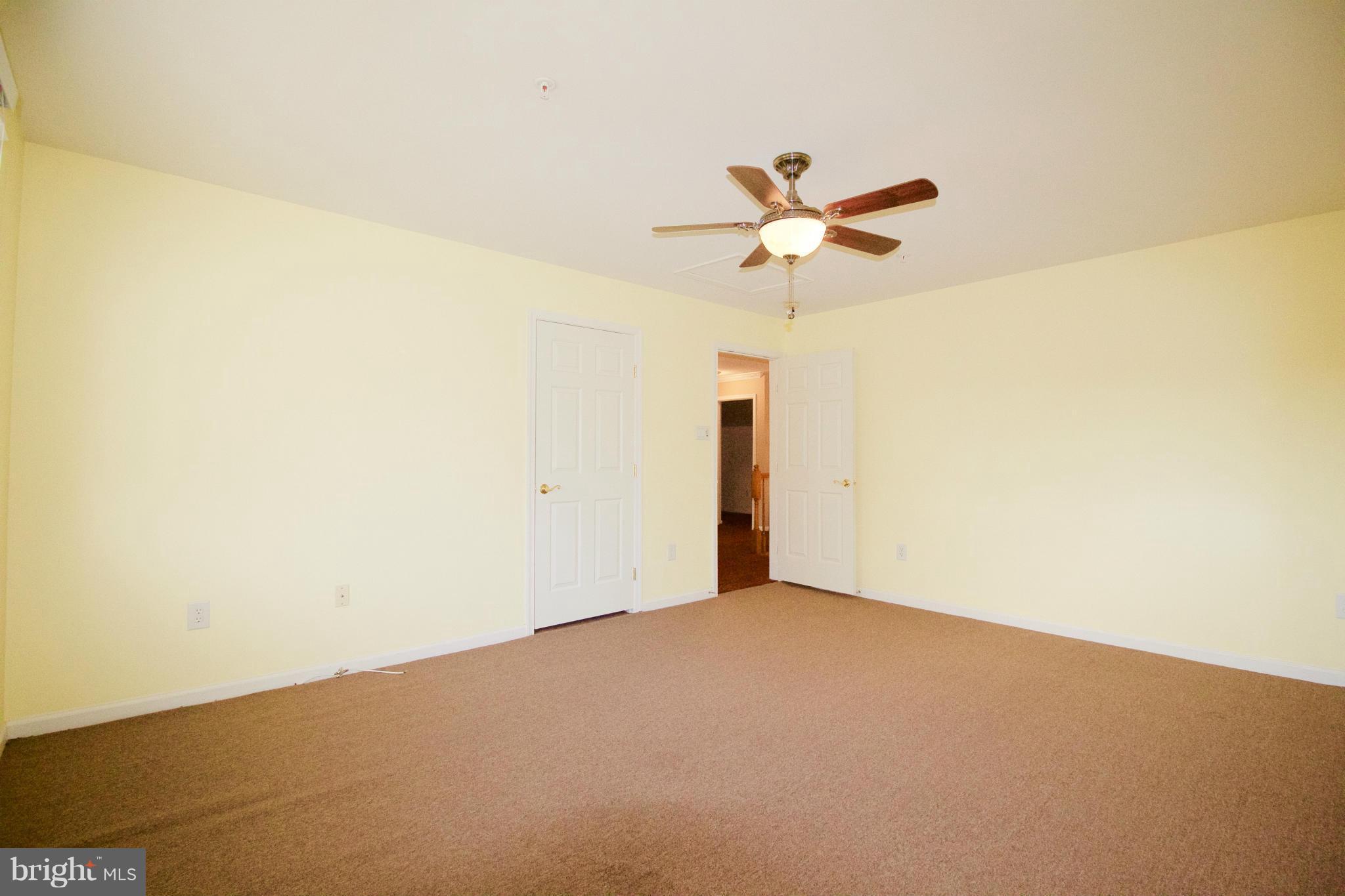 8411 Meadowsweet Road Pikesville, MD 21208 - Photo 18 of 30 a view of a big room with carpet