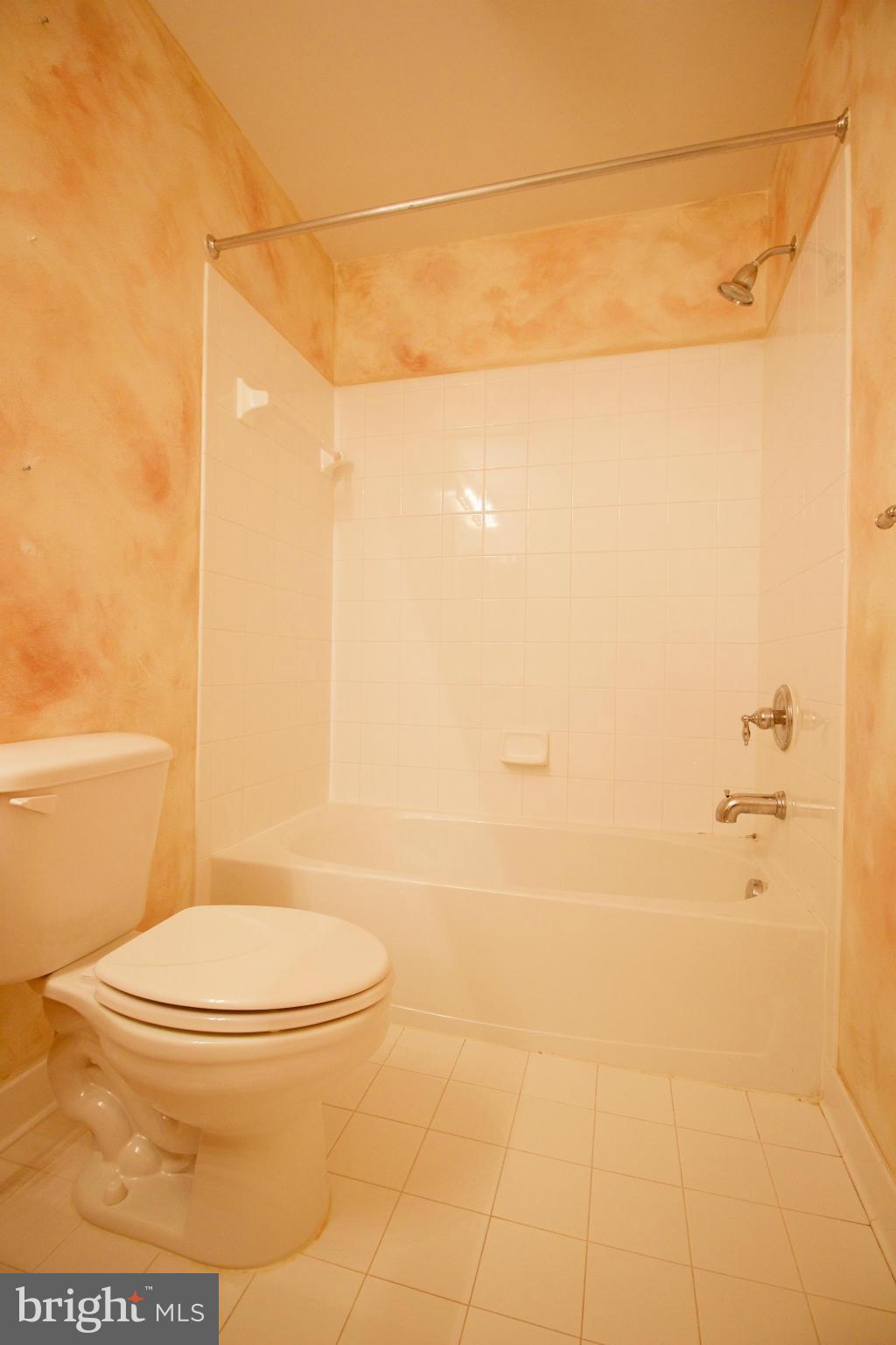 8411 Meadowsweet Road Pikesville, MD 21208 - Photo 22 of 30 a bathroom with a toilet and a shower