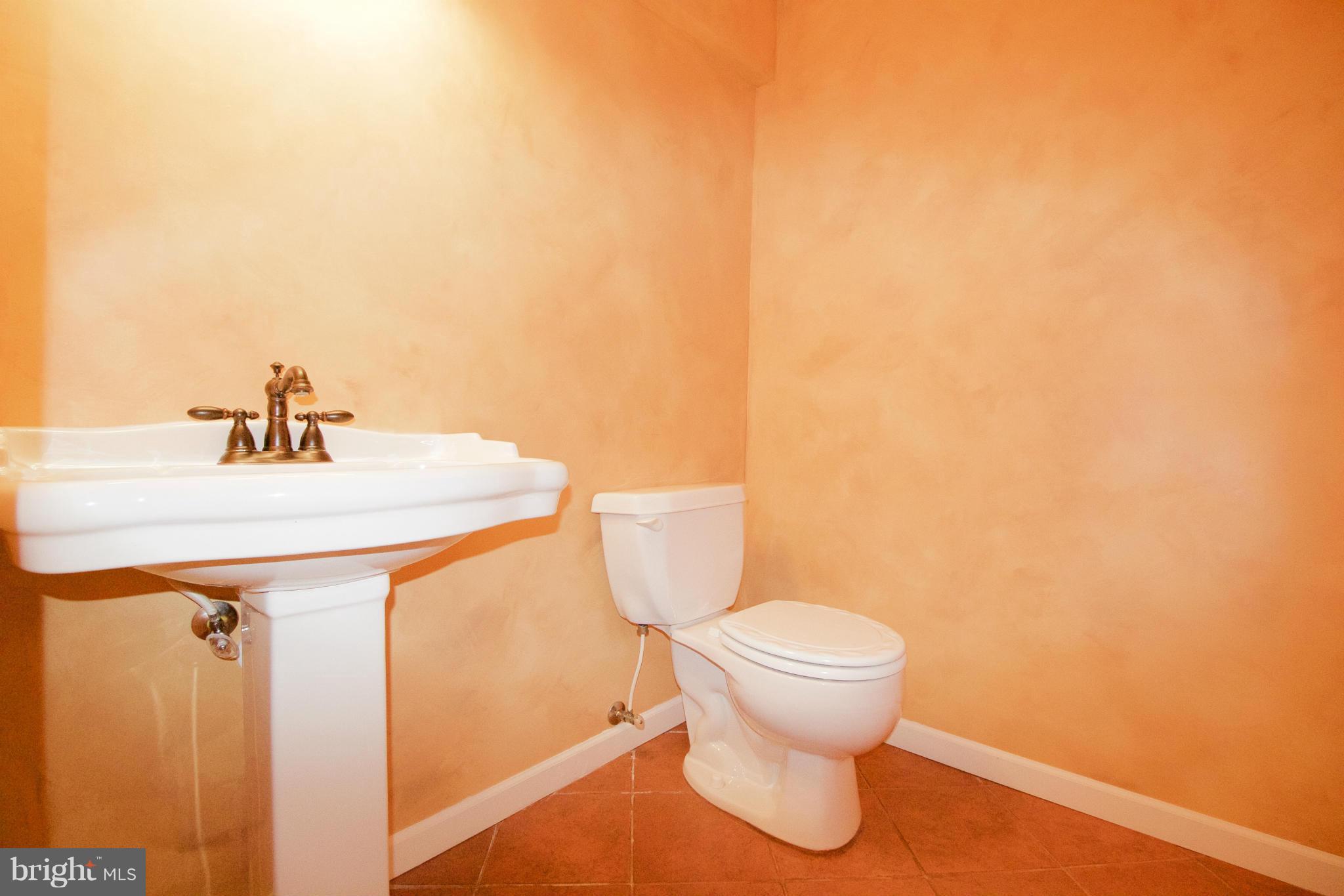 8411 Meadowsweet Road Pikesville, MD 21208 - Photo 29 of 30 a bathroom with a sink and a toilet