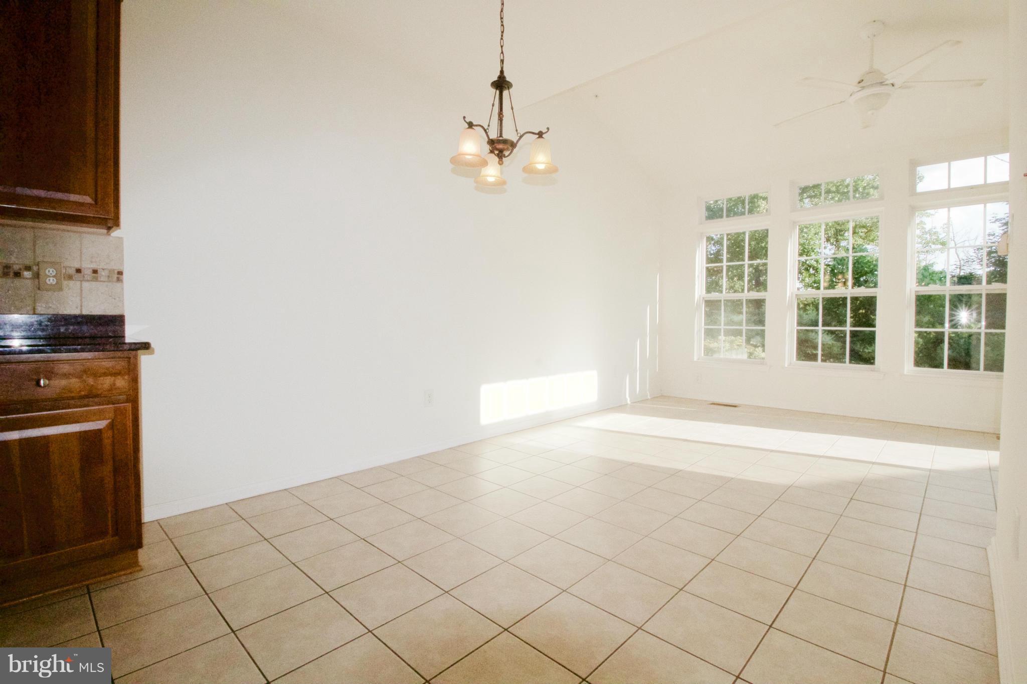 8411 Meadowsweet Road Pikesville, MD 21208 - Photo 9 of 30 a view of an empty room with a window