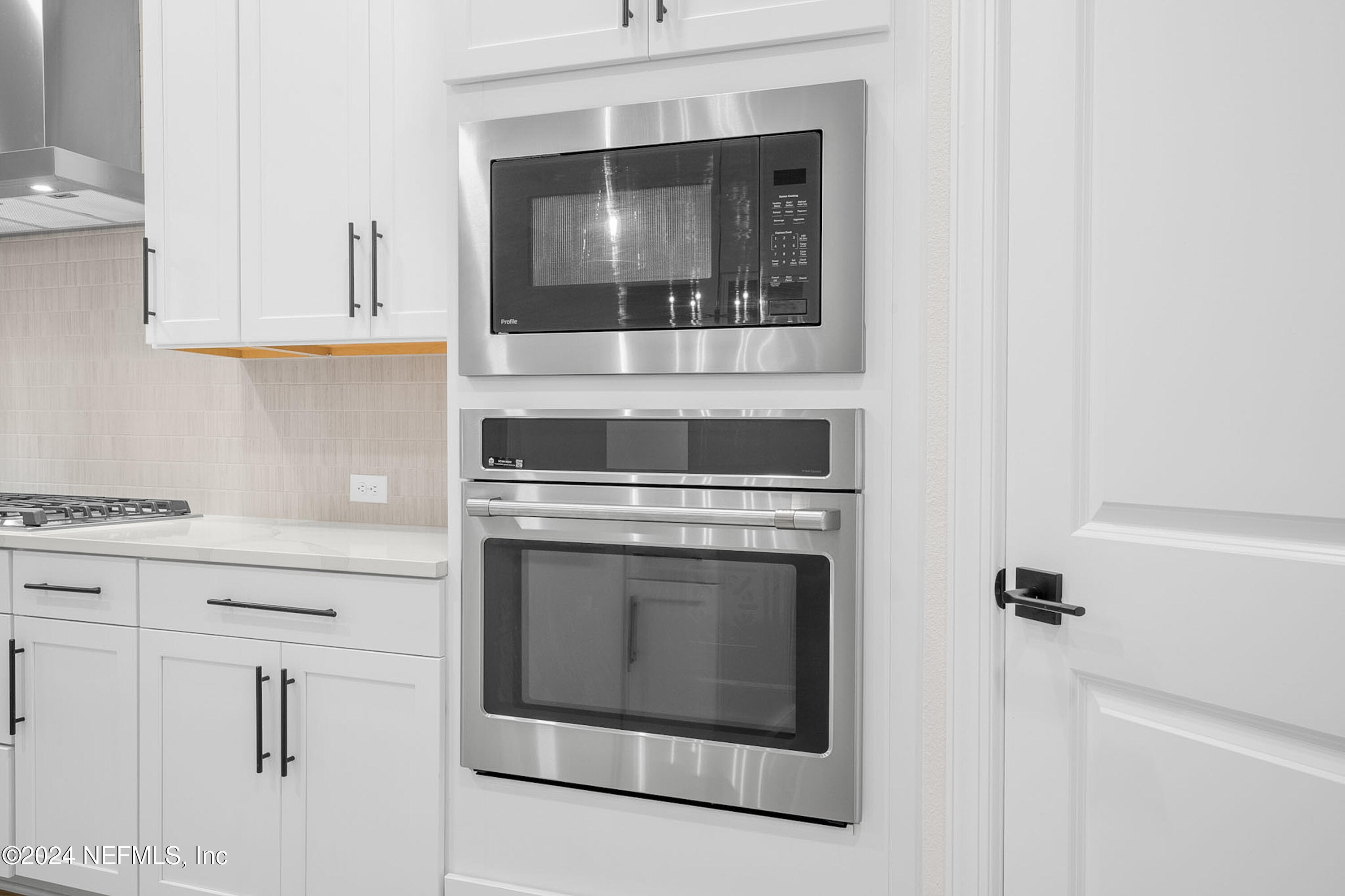 5620 Pathfinder Road Jacksonville, FL 32224 - Photo 8 of 19 a stove top oven sitting inside of a kitchen
