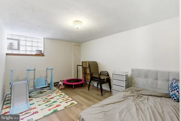 a room with furniture and a wooden floor