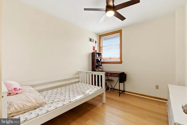 a bedroom with furniture and a window