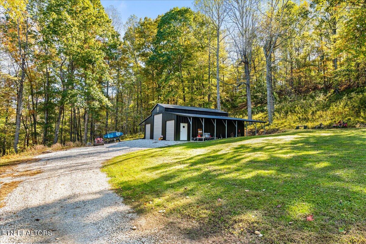 2938 Cedar Creek Road La Follette, TN 37766 - Photo 11 of 39 66ft-garage-with-14ft-door-cedar-creek
