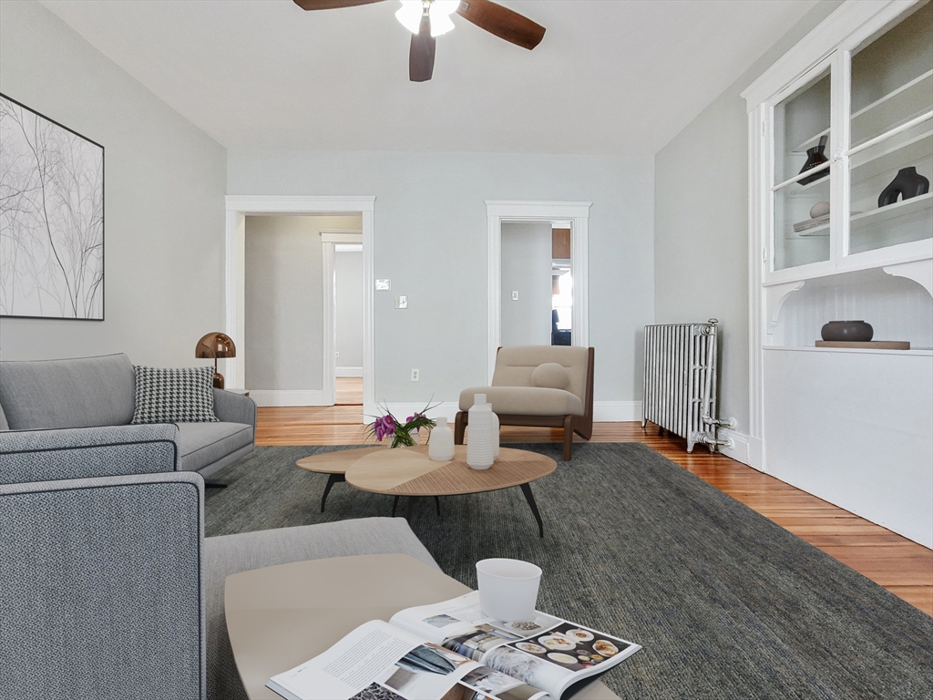 35 Dunlap Street, Unit 3 Boston, MA 02124 - Photo 2 of 9 a living room with furniture and a wooden floor