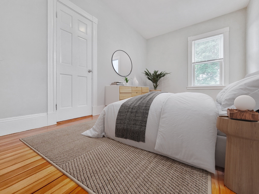 35 Dunlap Street, Unit 3 Boston, MA 02124 - Photo 5 of 9 a bedroom with a bed and window