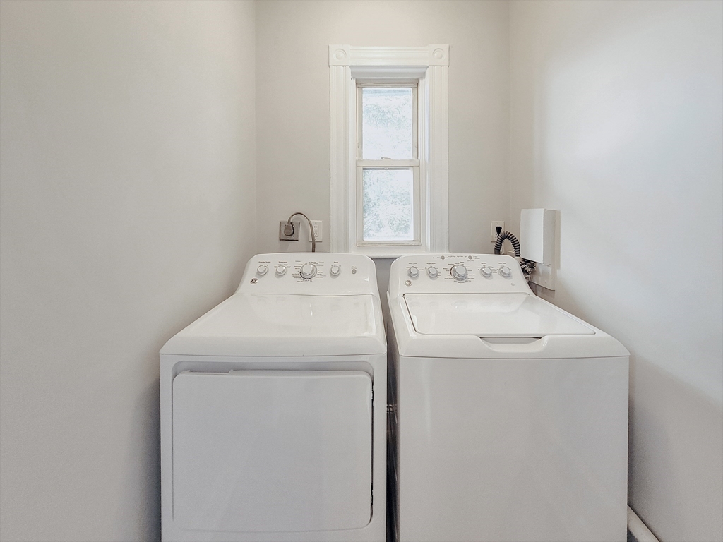 35 Dunlap Street, Unit 3 Boston, MA 02124 - Photo 9 of 9 a utility room with dryer and washer