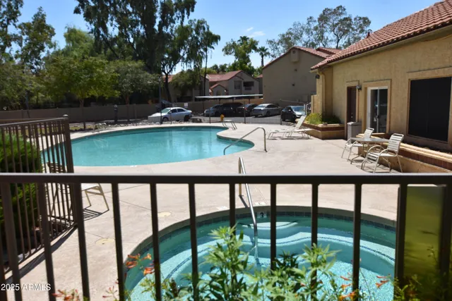 a view of swimming pool with patio