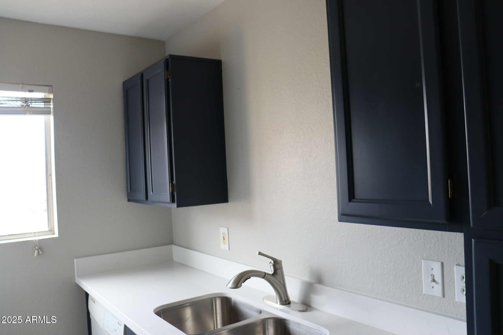 653 West Guadalupe Road, Unit 2005 Mesa, AZ 85210 - Photo 12 of 27 a bathroom with a sink and a mirror