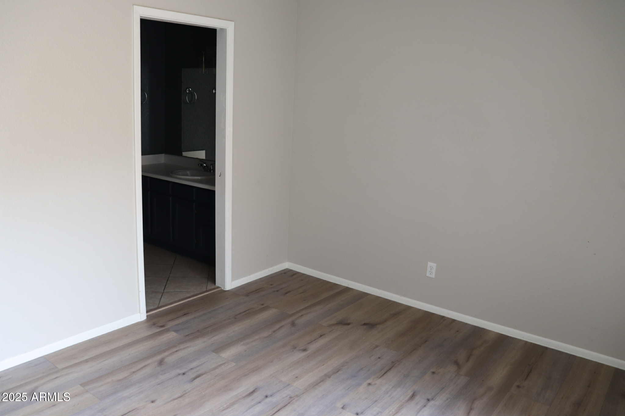 653 West Guadalupe Road, Unit 2005 Mesa, AZ 85210 - Photo 14 of 27 wooden floor in an empty room
