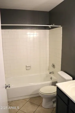 a kitchen with a sink a refrigerator and a window