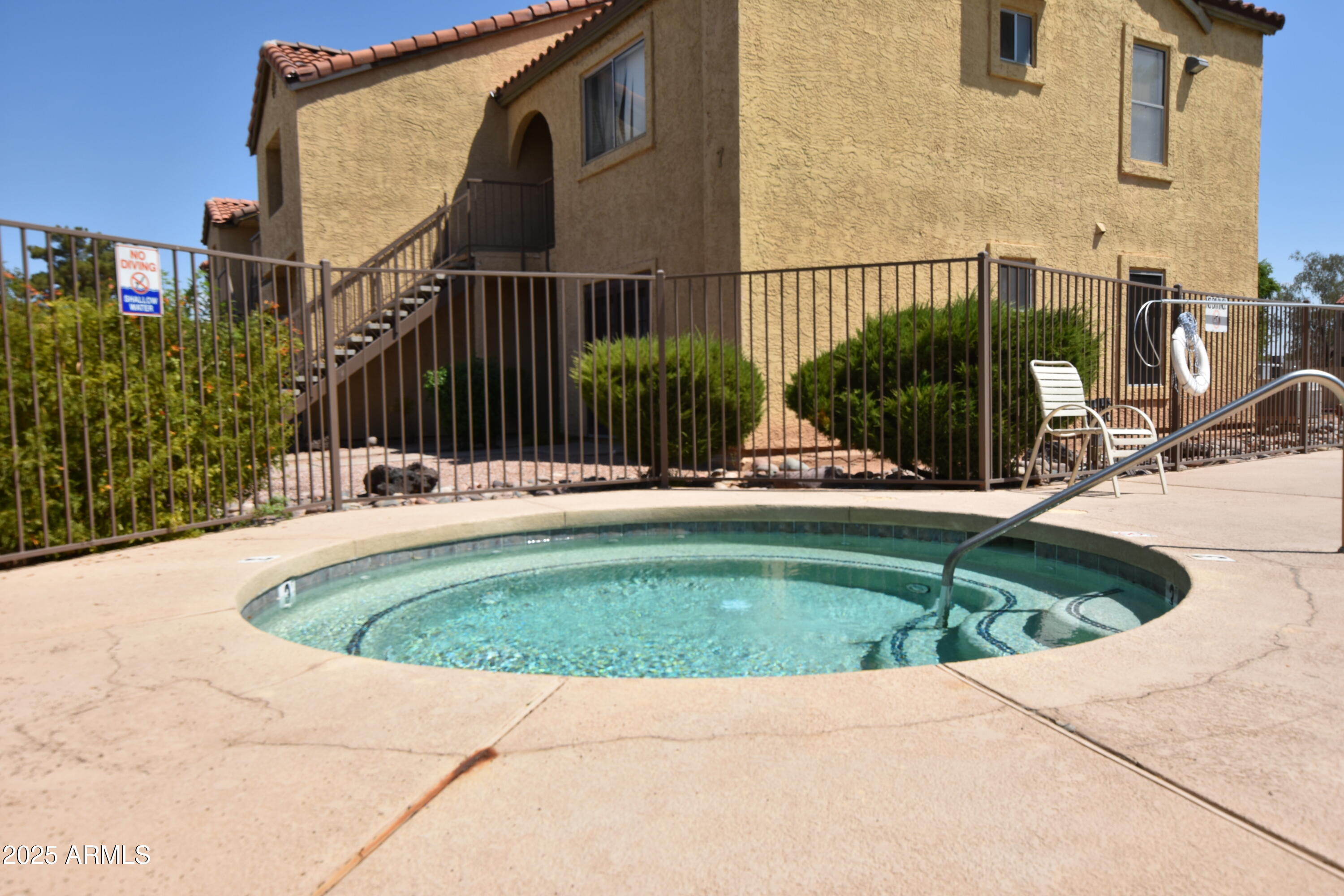 653 West Guadalupe Road, Unit 2005 Mesa, AZ 85210 - Photo 19 of 27 a swimming pool with outdoor seating and yard