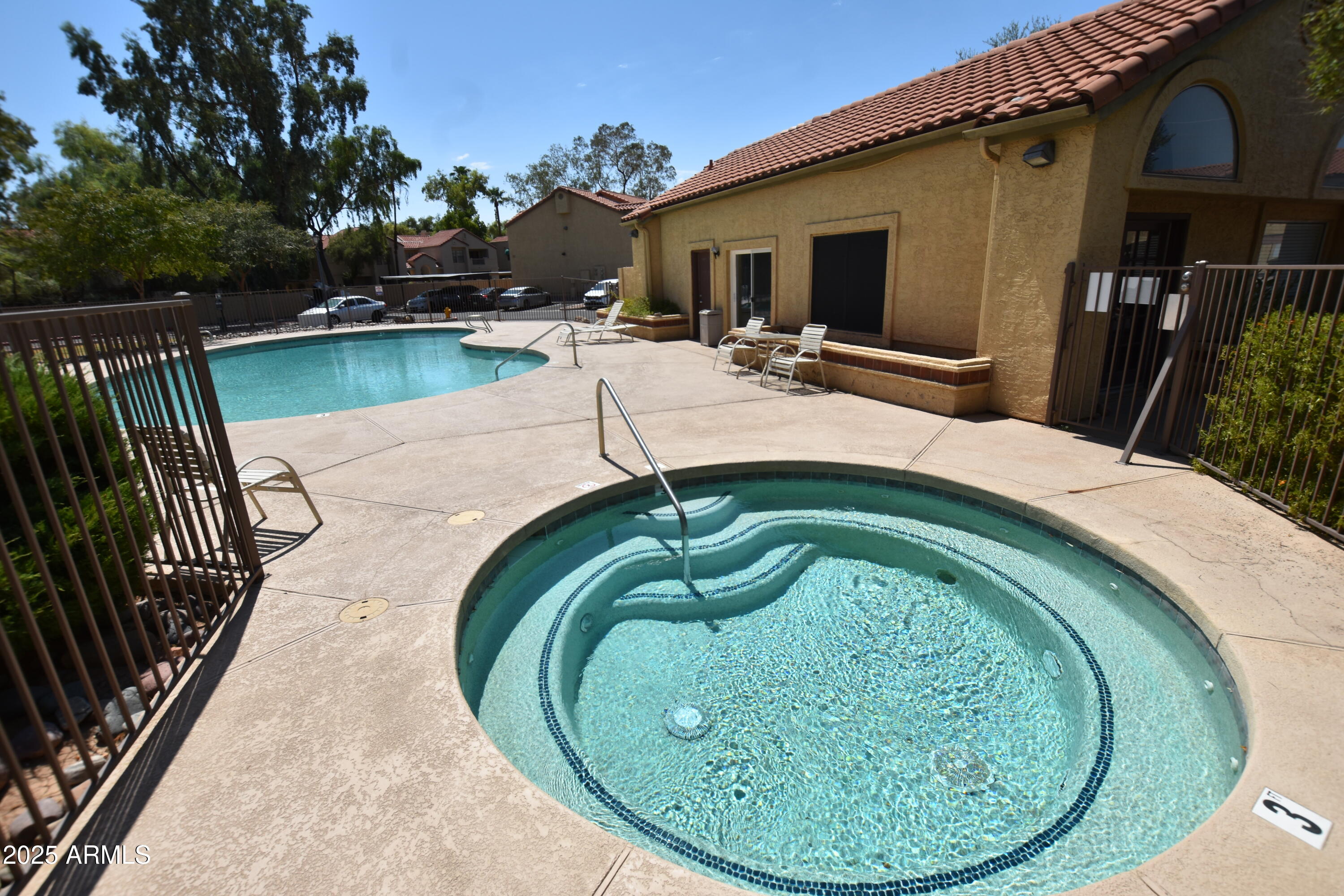 653 West Guadalupe Road, Unit 2005 Mesa, AZ 85210 - Photo 20 of 27 a view of swimming pool with outdoor seating and garden