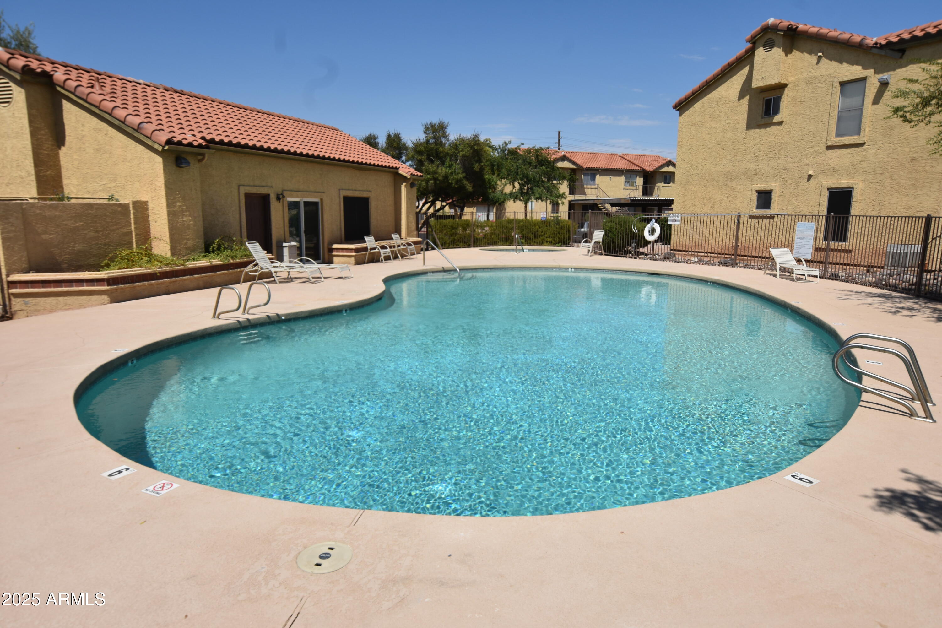 653 West Guadalupe Road, Unit 2005 Mesa, AZ 85210 - Photo 21 of 27 a view of a house with swimming pool