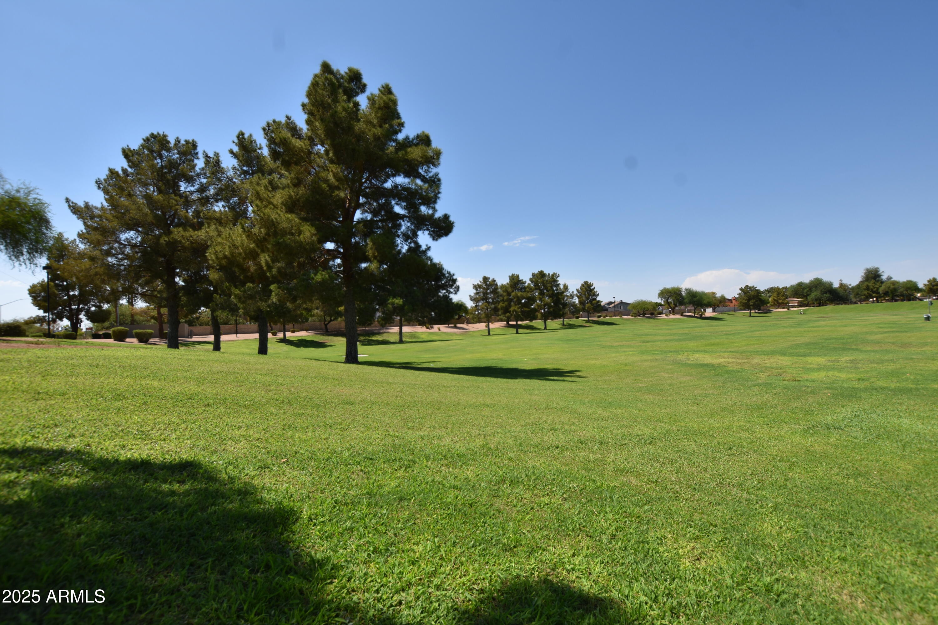 653 West Guadalupe Road, Unit 2005 Mesa, AZ 85210 - Photo 25 of 27 a front view of a house with a big yard