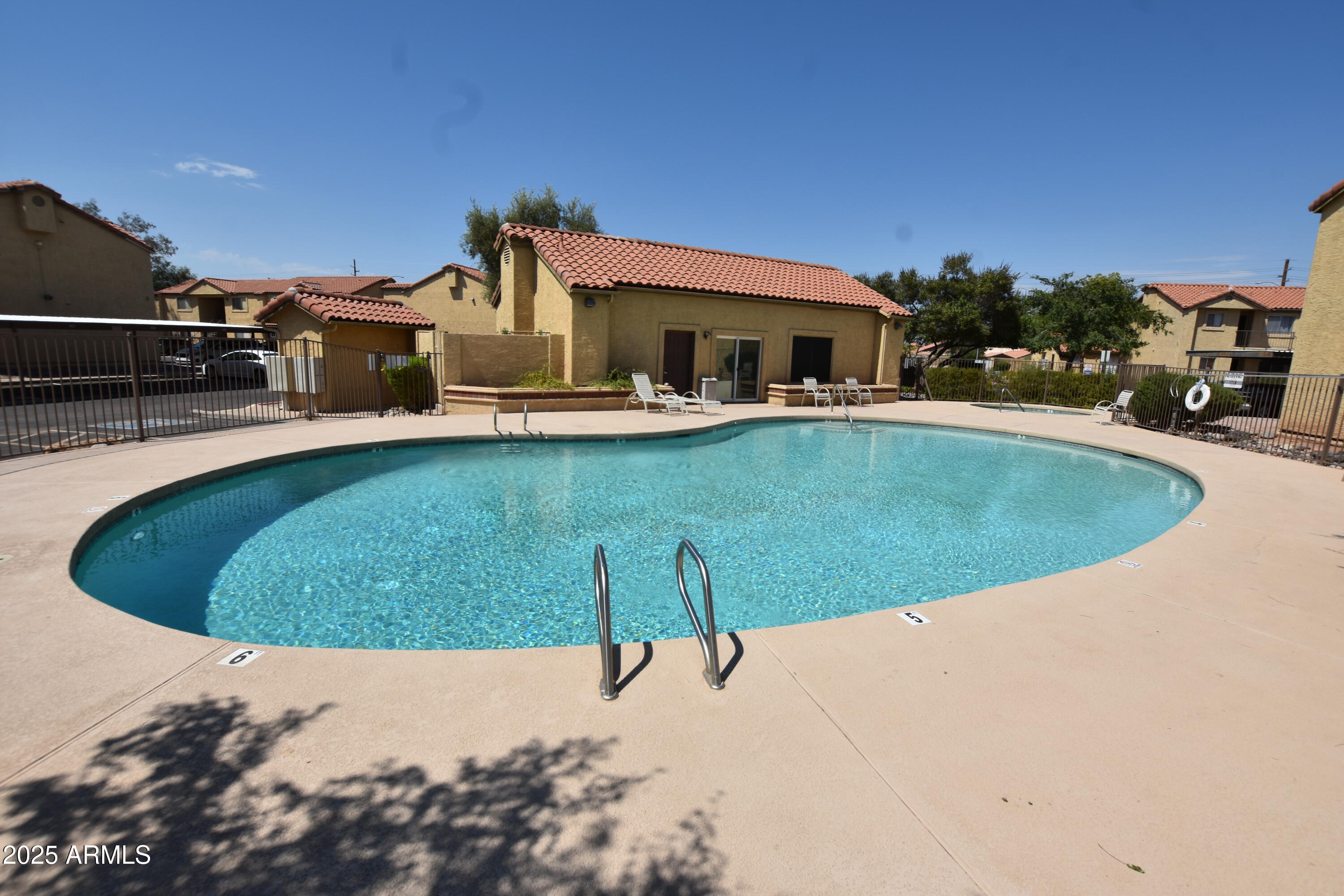 653 West Guadalupe Road, Unit 2005 Mesa, AZ 85210 - Photo 5 of 27 a view of a swimming pool with outdoor seating
