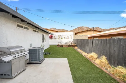 a view of a backyard with furniture