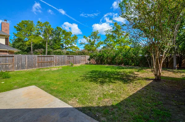 a view of a backyard with a garden