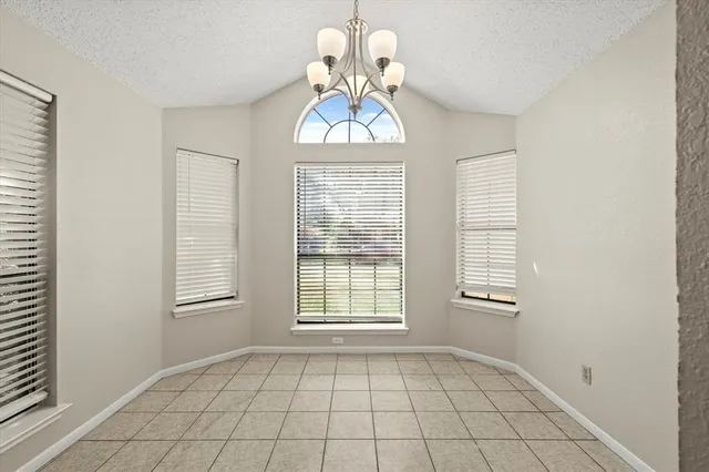 a view of an empty room with windows