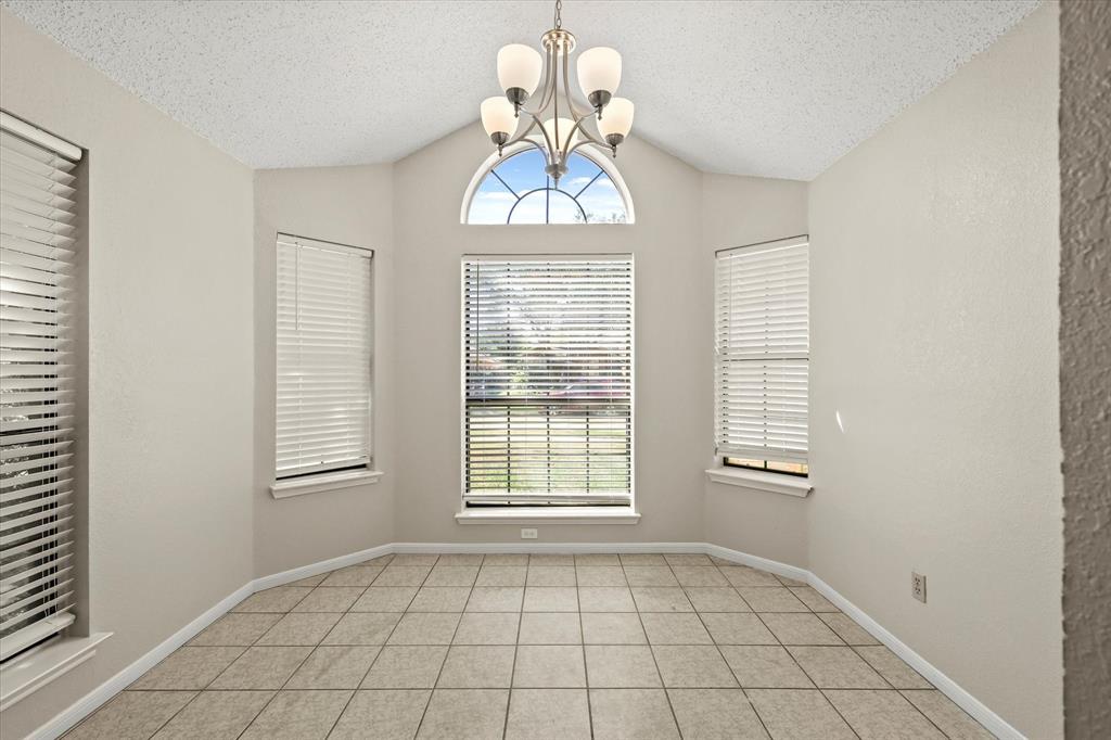 1113 Kit Lane Plano, TX 75023 - Photo 14 of 31 a view of an empty room with windows