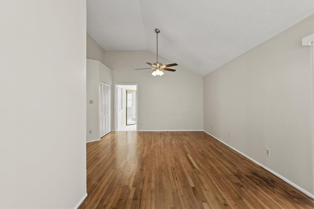 1113 Kit Lane Plano, TX 75023 - Photo 16 of 31 a view of a room with wooden floor and ceiling fan