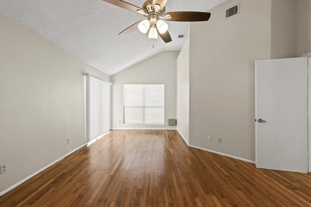 1113 Kit Lane Plano, TX 75023 - Photo 17 of 31 wooden floor in an empty room with a window