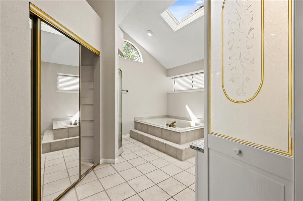 1113 Kit Lane Plano, TX 75023 - Photo 19 of 31 a room with table mirror and a painting on the wall