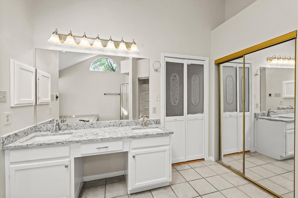 1113 Kit Lane Plano, TX 75023 - Photo 21 of 31 a bathroom with a sink vanity and a mirror