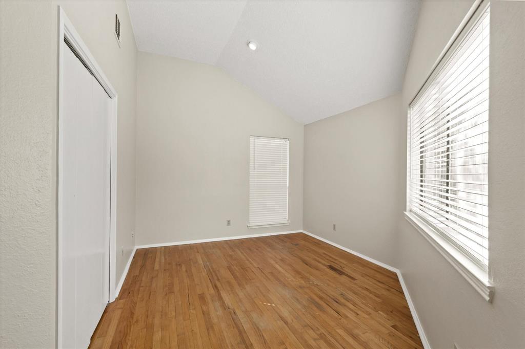 1113 Kit Lane Plano, TX 75023 - Photo 25 of 31 a view of empty room with wooden floor and fan